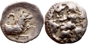 Lycaonia: Laranda (IV- III century BV) Obol. Obv:Baaltars seated left, holding grain ear, grape bunch, and scepter. Rev: Forepart of wolf right;