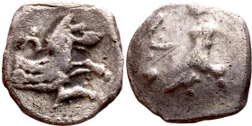 Lycaonia: Laranda (IV- III century BV) Obol. Obv:Baaltars seated left, holding grain ear, grape bunch, and scepter. Rev: Forepart of wolf right;