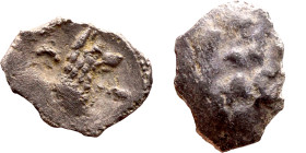 Lycaonia: Laranda (IV- III century BV) Obol. Obv:Baaltars seated left, holding grain ear, grape bunch, and scepter. Rev: Forepart of wolf right;