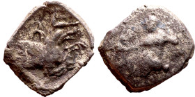 Lycaonia: Laranda (IV- III century BV) Obol. Obv:Baaltars seated left, holding grain ear, grape bunch, and scepter. Rev: Forepart of wolf right;