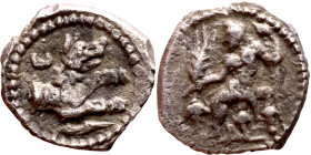 Lycaonia: Laranda (IV- III century BV) Obol. Obv:Baaltars seated left, holding grain ear, grape bunch, and scepter. Rev: Forepart of wolf right;