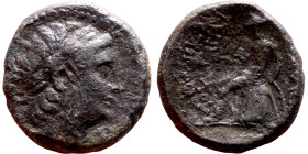 Antiochos III The Great (Seleukid King: 223-187 BC). AE bronze. Obv.: Laureate head of Apollo Rev.: Apollo seated left on omphalos, testing arrow and ...