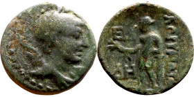 Hellenistic period coin (4-1 century BC) AE Bronze.  Obv: Bust of Apollo. Rev: Standing Figure