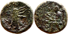 Hellenistic period coin (4-1 century BC) AE Bronze.  Obv: Unredable Rev: Seated figure (Apollo?)