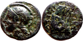 Hellenistic period coin (4-1 century BC) AE Bronze.  Obv: Bust of Athena Rev: sitting figure wearing a frigian hat