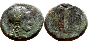 Pergamon (BC 200-133) bronze con. Obv: Bust of Athena. Rev: Nike in long chiton walking right