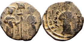 Seljuk (1037–1157, bronze coin in Byzantine style. Obverse: Two figures Reverse: standing figure