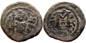 al-Malik ibn Marwan (687-705), Constans II style folis Obverse: Imperial figure holding globus Reverse: m and inscription