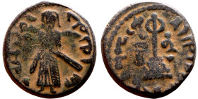 al-Malik ibn Marwan (687-705) Follis. Obverse: Imperial figure. Reverse: Modified cross potent set on steps