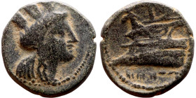 Hellenistic period coin (4-1 century BC) AE Bronze. Obverse: Bust of Tyche. Reverse: galley