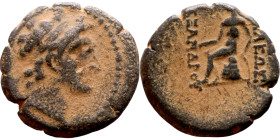 Alexander I Ballas (Seleukid king: 150-145) Bronze. Obverse: Diademed head of Alexander I right Rev: Apollo seated left on omphalos, testing arrow and...