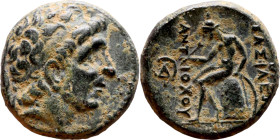 Antiochos III The Great (Seleukid King: 223-187 BC). AE bronze. Obv.: Laureate head of Apollo Rev.: Apollo seated left on omphalos, testing arrow and ...