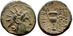 Antiochos VI Dionysos (Seleukid King: 145-141 BC). AE bronze. Obv: Radiate and diademed head Rev: Amphora; palm to r.; monogram below.