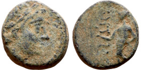 Antiochos III The Great (Seleukid King: 223-187 BC). AE bronze. Obv.: Laureate head of Apollo Rev.: Apollo seated left on omphalos, testing arrow and ...