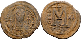 Justinian I (527-656) Follis. Obverse: DN IVSTINIANVS PP AVG, Armoured facing bust holding globus Reverse: Large M between ANNO and regnal year