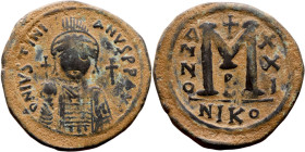 Justinian I (527-656) Follis. Obverse: DN IVSTINIANVS PP AVG, Armoured facing bust holding globus Reverse: Large M between ANNO and regnal year