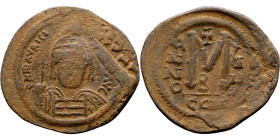 Maurice Tiberius (582-602) Follis. Obverse: Helmeted and cuirassed bust facing, holding globus cruciger and shield., Reverse: Large M above cross, ANN...