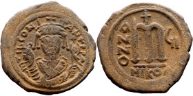 Tiberius II Constantine (578-582). Follis. Obverse: mperor, crowned and mantled bust facing, holding mappa and eagle-tipped sceptre, cross above eagle...