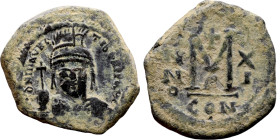 Maurice Tiberius (582-602) Follis. Obverse: Helmeted and cuirassed bust facing, holding globus cruciger and shield., Reverse: Large M above cross, ANN...