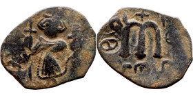 Constans II (641-668) Follis. Obverse: Imperial figure holding cross and globus Reverse: m and inscription