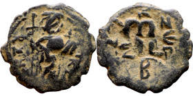 Constans II (641-668) Follis. Obverse: Imperial figure holding cross and globus Reverse: m and inscription