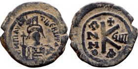 Maurice Tiberius (582-602) Follis. Obverse: Helmeted and cuirassed bust facing, holding globus cruciger and shield., Reverse: Large M above cross, ANN...