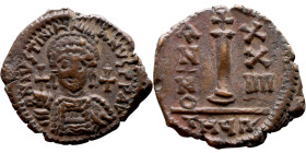 Justinian I (527-565) Decanummium Obverse: D N IVSTINIANVS P P AVG, diademed, helmeted, and cuirassed facing bust holding globus cruciger and shield, ...