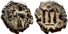 Constans II (641-668) Follis. Obverse: Imperial figure holding cross and globus Reverse: m and inscription