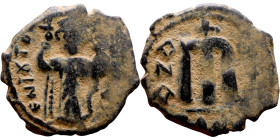 Constans II (641-668) Follis. Obverse: Imperial figure holding cross and globus Reverse: m and inscription