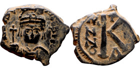 Maurice Tiberius (582-602) Half Follis. Obverse: Helmeted and cuirassed bust facing, holding globus cruciger and shield., Reverse: Large K above cross...