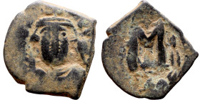 Constans II (641-668) Follis. Obverse: Imperial figure holding cross and globus Reverse: m and inscription