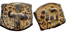Constans II (641-668) Follis. Obverse: Imperial figure holding cross and globus Reverse: m and inscription