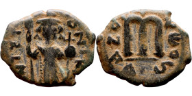 Constans II (641-668) Follis. Obverse: Imperial figure holding cross and globus Reverse: m and inscription