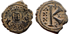 Maurice Tiberius (582-602) Half Follis. Antioch. Obverse: Crowned bust facing, wearing consular robes, holding mappa and eagle-tipped scepter , Revers...