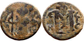 al-Malik ibn Marwan (687-705), Constans II style folis Obverse: Imperial figure holding globus Reverse: m and inscription