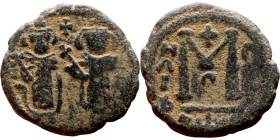 al-Malik ibn Marwan (687-705), Constans II style folis Obverse: Imperial figure holding globus Reverse: m and inscription