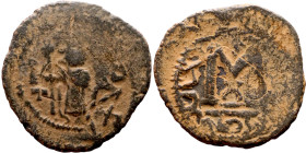 al-Malik ibn Marwan (687-705), Constans II style folis Obverse: Imperial figure holding globus Reverse: m and inscription