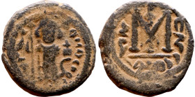 al-Malik ibn Marwan (687-705), Constans II style folis Obverse: Imperial figure holding globus Reverse: m and inscription