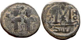 al-Malik ibn Marwan (687-705), Constans II style folis Obverse: Imperial figure holding globus Reverse: m and inscription