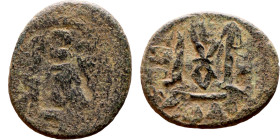 al-Malik ibn Marwan (687-705), Constans II style folis Obverse: Imperial figure holding globus Reverse: m and inscription