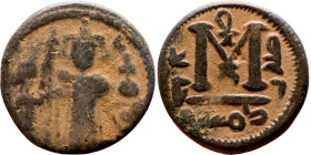 al-Malik ibn Marwan (687-705), Constans II style folis Obverse: Imperial figure holding globus Reverse: m and inscription