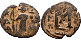 al-Malik ibn Marwan (687-705), Constans II style folis Obverse: Imperial figure holding globus Reverse: m and inscription