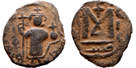 al-Malik ibn Marwan (687-705), Constans II style folis Obverse: Imperial figure holding globus Reverse: m and inscription