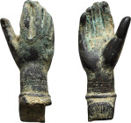 This bronze hand appears to be a distinctive Roman artifact, perhaps used as a symbol or as part of a larger statue. The design of the hand suggests t...