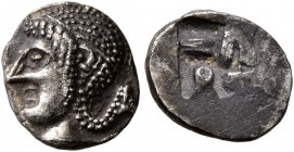 GAUL. Massalia. Circa 475-460 BC. Obol (Silver, 9 mm, 0.76 g), Phokaic standard. Archaic head of Apollo to left. Rev. Rough swastika pattern incuse sq...