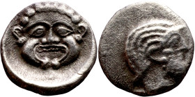 Hellenistic period coin (4-1 century BC) Silver coin. Obverse: Head of gorgon  Rev: helmeted bust to left