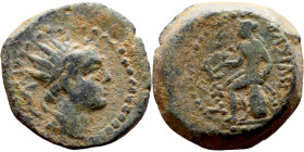 Antiochos IV Epiphanes (Seleukid King: 175-164 BC). AE bronze. Obv.: Radiate and diademed head right. Rev.: Apollo seated left on omphalos, testing ar...