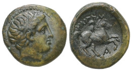 Kings Of Macedon, Philip II. Ae, 5.83 g 18.21 mm. 359-336 BC. Uncertain mint in Macedon.
Obv: Diademed head of Apollo right.
Rev: ΦΙΛΙΠΠΟΥ. Naked yout...