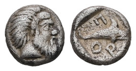 Mysia, Pordosilene. AR Hemiobol, 0.45 g 7.00 mm. Circa 450-400 BC. 
Obv: Bearded head of Silenos to right, with an animal ear. 
Rev: Π-ΟΡ, Dolphin swi...