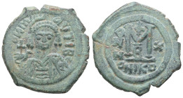 Maurice Tiberius, AD 582-602. AE, Follis. 12.04 g. 27.68 mm. Nicomedia.
Obv: D N MAV TIB. Crowned, draped and cuirassed bust facing, holding cross on ...